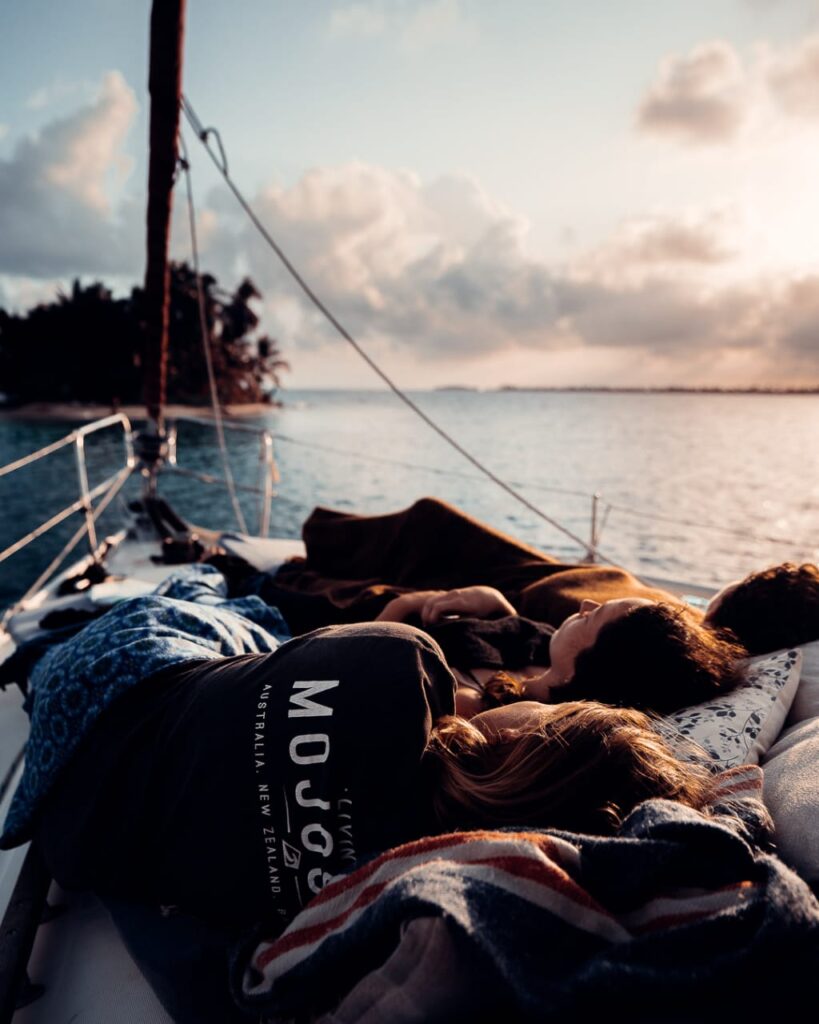 people relaxing on deck of a sailboat in san blas Sea Gypsy