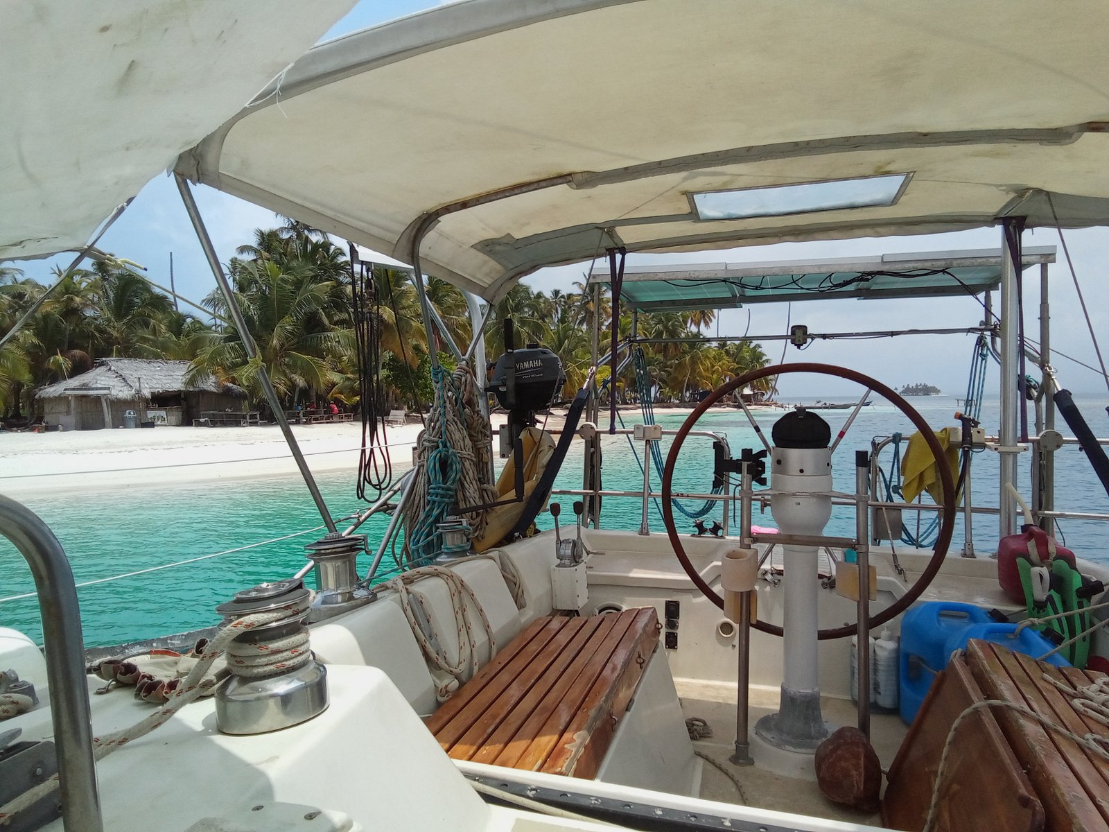 At the helm of a sailboat